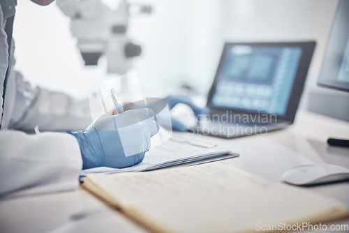 Image of Science, research and hands in lab with notebook and computer on scientific analysis. Experiment, internet and analytics, scientist in laboratory with data, vision and future in medical innovation.