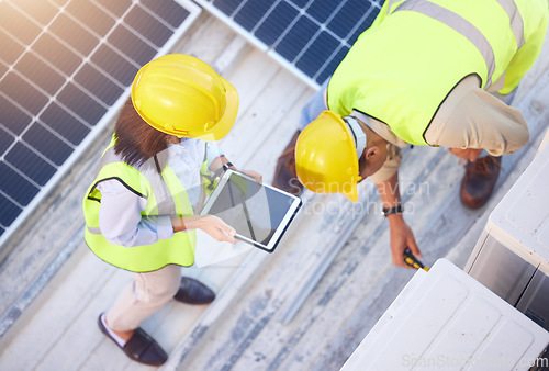 Image of Top view, teamwork and engineers with tablet on solar roof for maintenance, inspection or installation. Solar energy, renewable energy and man and woman with tech for planning service of solar panels