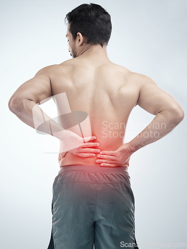 Image of Injury, back pain or man in studio with spine or hurt body problem after training isolated on studio background. Back view, red glow or person with muscle tension, body crisis or emergency accident