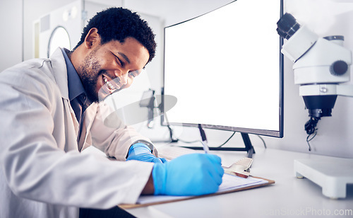 Image of Mockup, science and black man with computer, research and typing for data analysis, healthcare and cure. Medical professional, researcher and Nigerian scientist with focus, online search and digital.