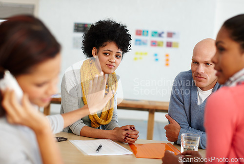 Image of Office, communication and phone call with stop hand for distraction, silence and focus. Shut up, quiet and rude girl employee on smartphone talking at desk with unhappy coworkers together.