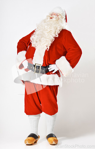 Image of Christmas, holiday and santa man in suit for festive, happy and cheerful celebration marketing. Traditional santa claus full body with studio mockup and white background for advertising.
