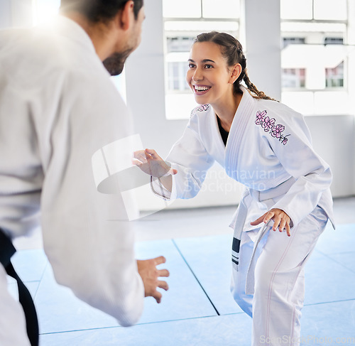 Image of Karate, fitness and teacher with student, combat sports and training for skill development, power and discipline in dojo gym. Fight, happy in taekwondo class and martial arts with sport exercise.