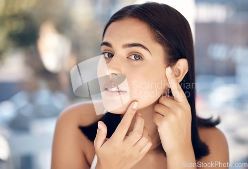 Image of Beauty, acne and face of woman with skincare hygiene, routine and grooming check with concern. Aesthetic, thinking and facial girl feeling skin texture from pimple cosmetic treatment.