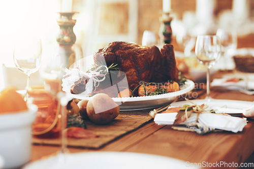 Image of Turkey, food and thanksgiving table for traditional celebration with no people, setup and luxury meal. Chicken, event and party layout with meat and vegetables, ready for sunday lunch in family home