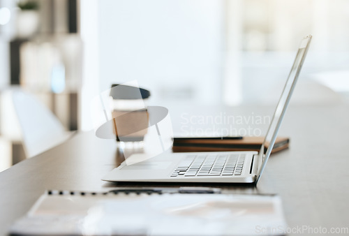 Image of Empty table with files, coffee and laptop with notebook, folder and financial portfolio of economy, stock market or trading research. Digital tech for online study of cryptocurrency investment growth