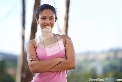 Image of Young woman, portrait and runner, arms crossed for fitness workout in nature park, exercise wellness and body healthcare or cardio training. Athlete person, running motivation and happy outdoor