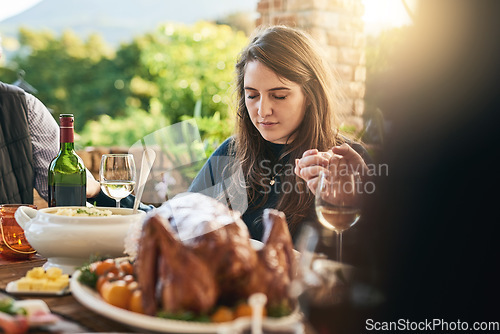 Image of Family, food and prayer at table, hand holding and praying before sharing meal on patio, blessing and gratitude. Pray, hands and woman in thanksgiving grace before eating lunch with friends outdoor