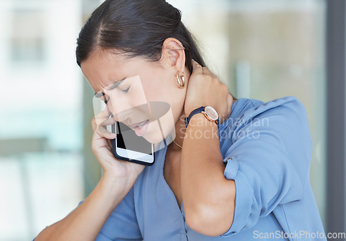 Image of Neck pain, smartphone and business woman on telehealth phone call for advice on fatigue, burnout and healthcare in office workplace. Sad, muscle pain or tired corporate employee talking on cellphone