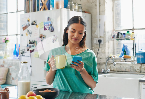 Image of Phone, coffee or woman in house kitchen for communication or social network on media app in morning. Tea, smile or happy girl on smartphone reading social media news, networking or mobile internet