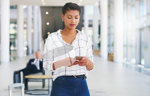 Image of Business woman, phone or reading email communication on web app while sitting at office. Black woman smartphone typing, message app or social media on mobile smartphone or internet technology at work