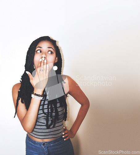 Image of Black woman, shocked and surprised with hand over her mouth in expression against a gradient studio background. African American female model face posing in shock for sale, secret or gossip on mockup