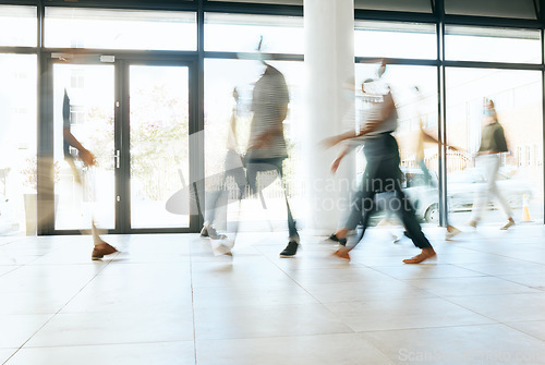 Image of Motion blur, busy office and business people walking, moving or fast speed in workplace, startup company or agency. Group of workers, crowd and employees rush movement in lobby, building and hallway