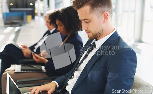 Image of Laptop, hiring and businessman in line for a job interview in corporate global startup company in an office building. Recruitment, diversity and business people waiting for a meeting with management