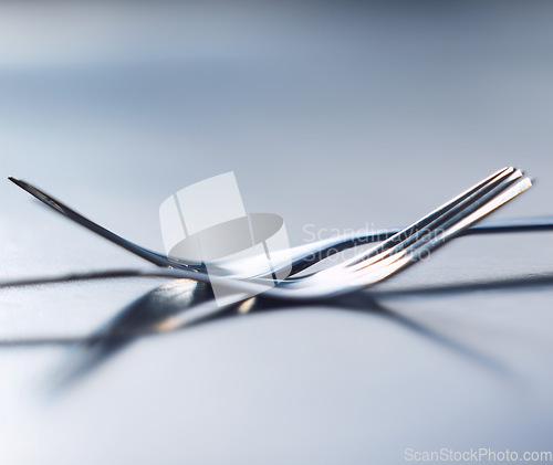 Image of Metal fork, cutlery and hospitality silverware utensile for catering business or restaurant with togetherness, solidarity and unity on table. Teamwork, life balance and partnership for a food company