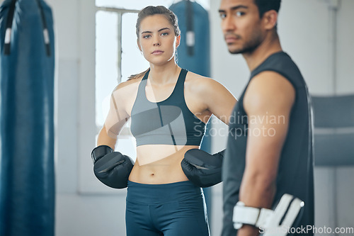 Image of Boxing gym, combat sport and woman training for fight, exercise and workout challenge in fitness club. Portrait of strong athlete and powerful sport people with personal trainer, coach and kick boxer