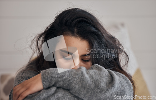 Image of Woman, stress and depression in lonely mental health problems, issues or anxiety at home. Sad female face suffering from loneliness, withdrawal or abuse with depressed emotion alone in the bedroom