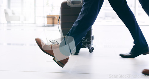 Image of Businessman in shoes, travel with suitcase and walking in hotel building commute to work trip in New York. Corporate leadership example, feet on airport ground and steps to success in company office