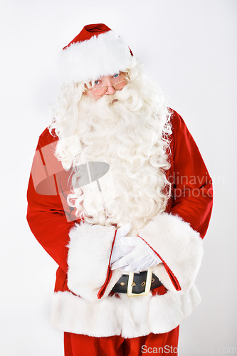 Image of Portrait of father Christmas in studio with white background in a red costume for Christian winter holiday celebration. Marketing, senior or santa claus face with sales offer, promo or discount deals