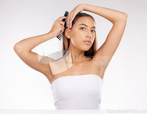 Image of Hair, portrait and woman with comb in studio for beauty, grooming and hair care on white background mockup. hairstyle, brushing and wellness girl model relax while styling long hair, calm and content