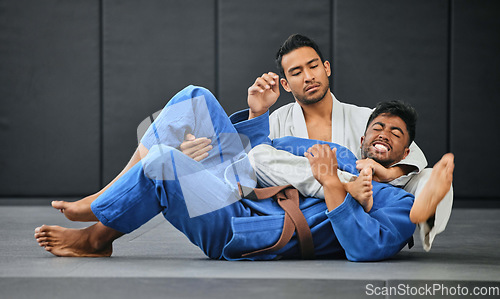 Image of Men fighting in karate competition, coach training student at fitness class and learning martial arts at sports club together. Strong trainer doing health exercise with male and showing self defense