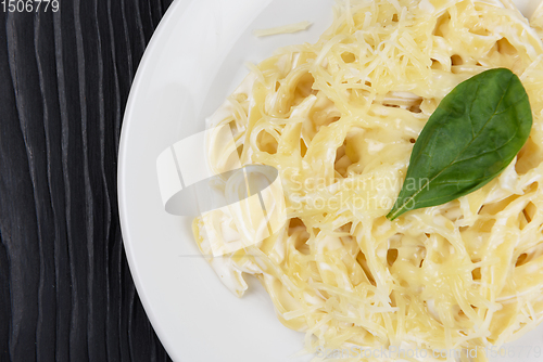 Image of Pasta with sauce and basil