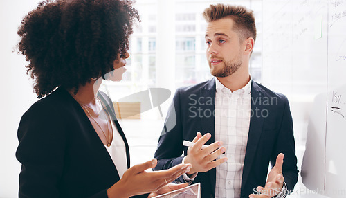 Image of Diversity, black woman and businessman brainstorming on a whiteboard in a meeting for a strategy, innovation or solution. Ideas, teamwork and creative startup company developer talking to an employee