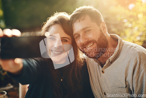 Image of Happy, phone and couple love to take a selfie at an outdoor restaurant for a romantic date in spring. Relax, memory and young woman taking pictures with a young partner smiles on marriage anniversary