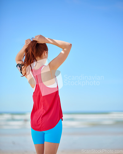 Image of Fitness, beach and running with a sports woman by the sea or ocean for summer exercise with mockup. Nature, freedom and workout with a female athlete or runner cardio training alone on the coast
