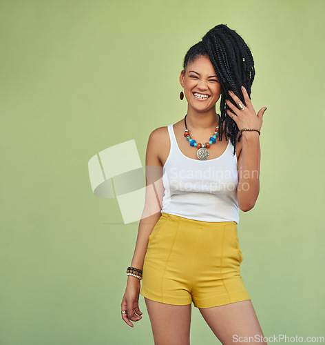 Image of Fashion, portrait and natural black woman with braids enjoying youth, vacation and summer freedom. Happy, wellness and excited smile of young Jamaican girl standing at green background mock up.