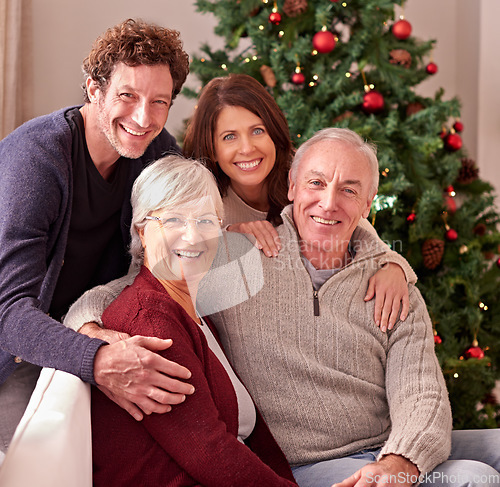 Image of Happy family, portrait and grandparents home for Christmas to celebrate together with daughter and son. Elderly parents, man and woman love spending quality time or bonding on sofa in winter holidays