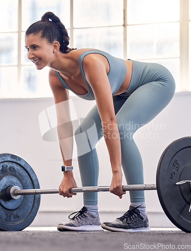 Image of Bodybuilder, strong and weightlifting with woman and fitness in gym, exercise and weights workout routine for muscle and power. Bodybuilding, body training and endurance for health and wellness.