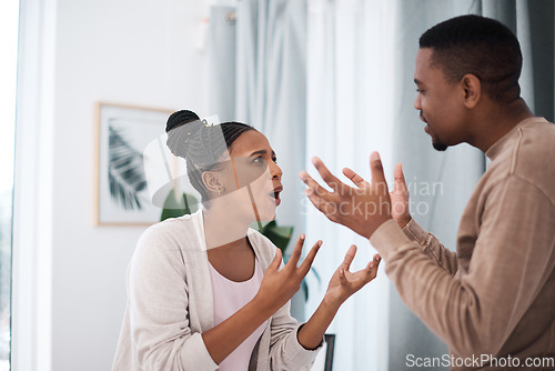 Image of Divorce, angry or black couple fight about money loan, mortgage debt or financial problems at home in Nigeria. Anger, communication and stressed black woman shouting at a frustrated African partner