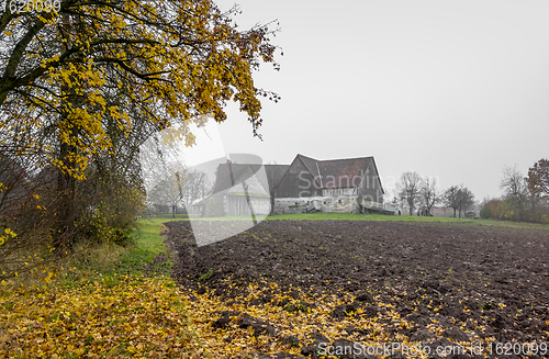 Image of old farmhouse at autumn time