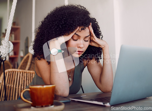 Image of Black woman, laptop and headache from stress, anxiety or overworked in remote business at home. African American female holding head and suffering from burnout, mental health issues or bad difficulty