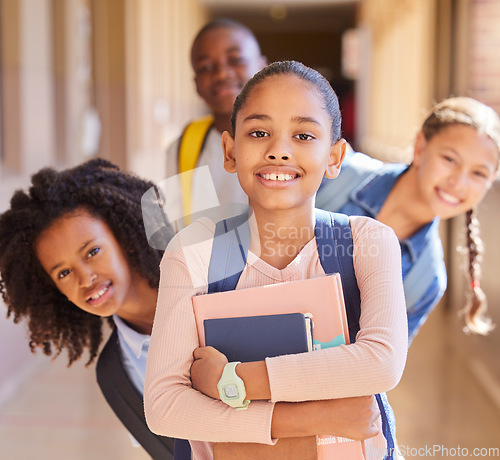 Image of Education, children and portrait of friends at school together standing in the hallway for class. Diversity, backpack and happy students with a smile playing in the corridor of the campus with books.