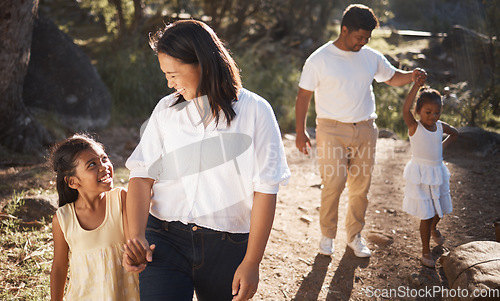 Image of Family, happy and walking in the park for bonding, fun and care in summer outside. Mother, father and parents playfully walk with girl children, kids and siblings in nature garden for summer bonding