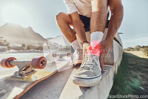 Image of Skateboard man, injury and ankle pain, legs and outdoor accident, emergency or first aid risk with red glow at skatepark. Joint pain, bone health and wound fracture of skateboarder in sports accident