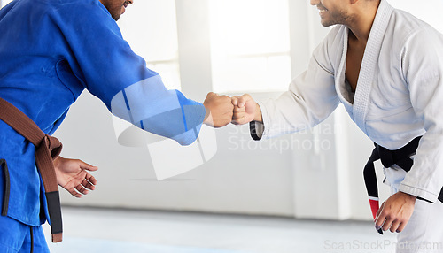 Image of Men in karate club, training focus and fist bump for competition fight in Japan. People greeting, learning martial arts fitness and healthy lifestyle in mma sports center with champion athletes