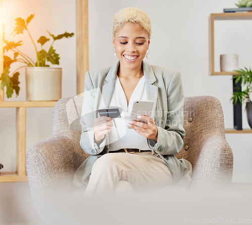 Image of Online shopping, smile and woman with phone and credit card sitting on armchair in living room. Ecommerce, happy shopping and girl surfing internet retail website for sale or discount with budget.