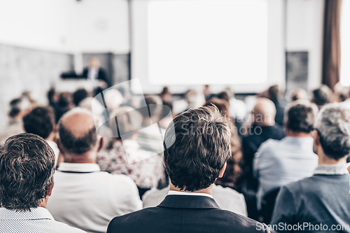 Image of Business speaker giving a talk at business conference event.