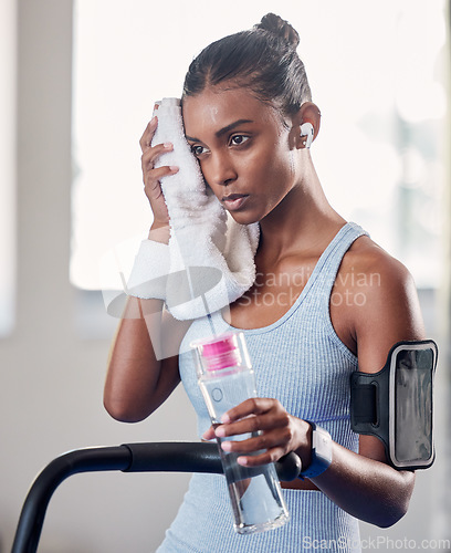 Image of Black woman, gym and rest with towel for fitness, health and workout for strong body, muscle and focus. Woman, exercise and relax with cloth for sweat while training, running and cardio on treadmill