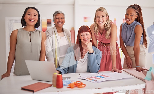 Image of Laptop, fashion and team of creative women in meeting to plan a project together in the office. Diversity, designers and portrait of female group in collaboration working on clothes in the workplace.