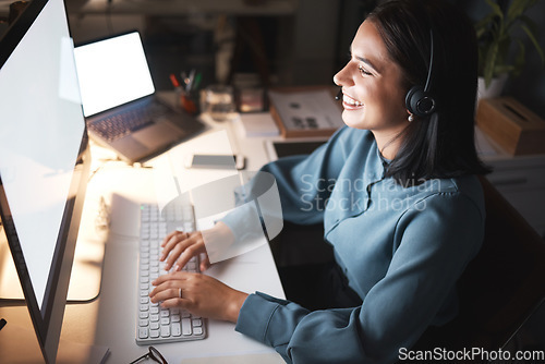 Image of Call center, night and computer with woman in telemarketing communication, e commerce sales chat and insurance advisor smile. Monitor, office help desk or virtual IT support agent on pc screen typing