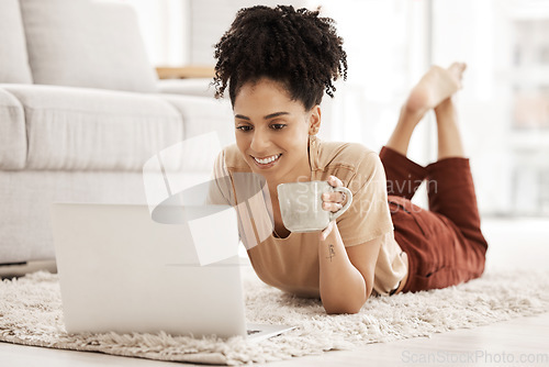 Image of Computer remote work, black woman and living room floor with morning coffee working on an email. African woman happy on wifi, laptop and technology job online with a smile in a living room house