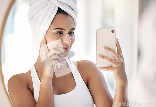 Image of Phone, selfie and shower with a woman taking a photograph in the bathroom of her home in the morning. Towel, fresh and reflection with a female posing for a beauty picture in a mirror after cleaning