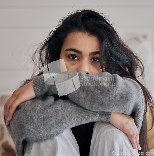 Image of Face portrait, sad and woman with depression in home feeling lonely and unhappy. Anxiety, mental health and female in house alone depressed, suffering from bad relationship or loss, grief or break up