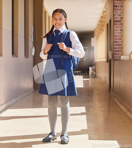 Image of School, student girl and in uniform for education, class and happy with smile, confident and outdoor. Portrait, female pupil or learner with happiness, pride or ready for lesson, teaching or studying