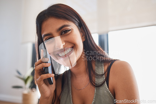 Image of Woman, smile and phone call in home portrait for communication, conversation or talking with happiness. Girl, smartphone and happy in living room, lounge or house for networking on phone in Mumbai