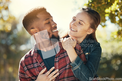 Image of Nature, walking and diversity couple with outdoor adventure, travel and journey for wellness, love and support in summer bokeh. Happy black man with woman on piggyback ride for holiday, vacation date